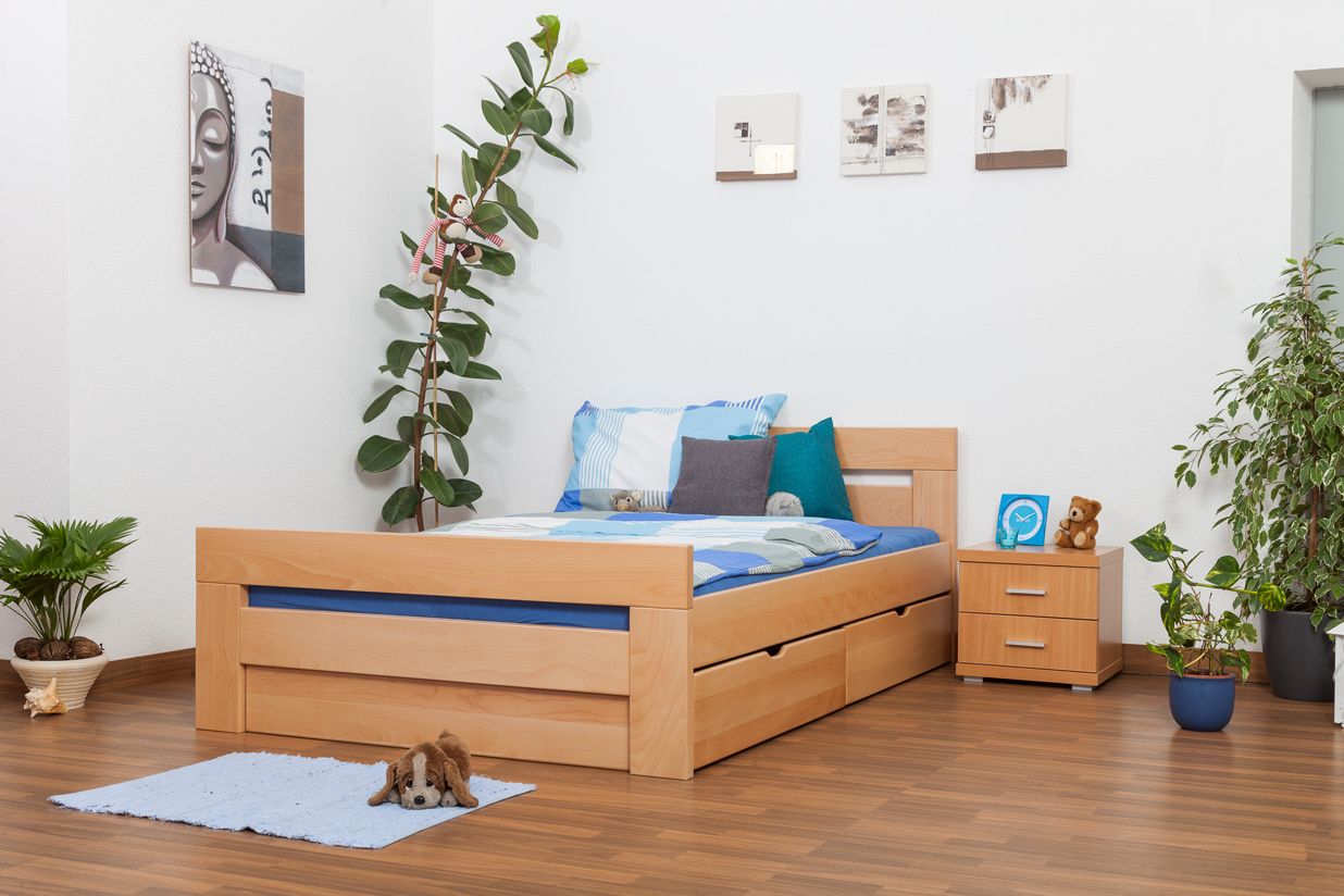 Jugendbett "Easy Premium Line" K6 inkl. 4 Schubladen und 2 Abdeckblenden 140 x 200 cm Buche Vollholz massiv Natur